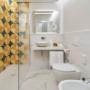 Guest Room Bathroom at The Britannique Naples, Curio Collection by Hilton