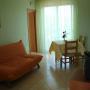 salotto con angolo cottura