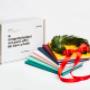 Tesi di laurea e corona di alloro con packaging