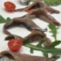 Alici marinate con pomodorini e rucola